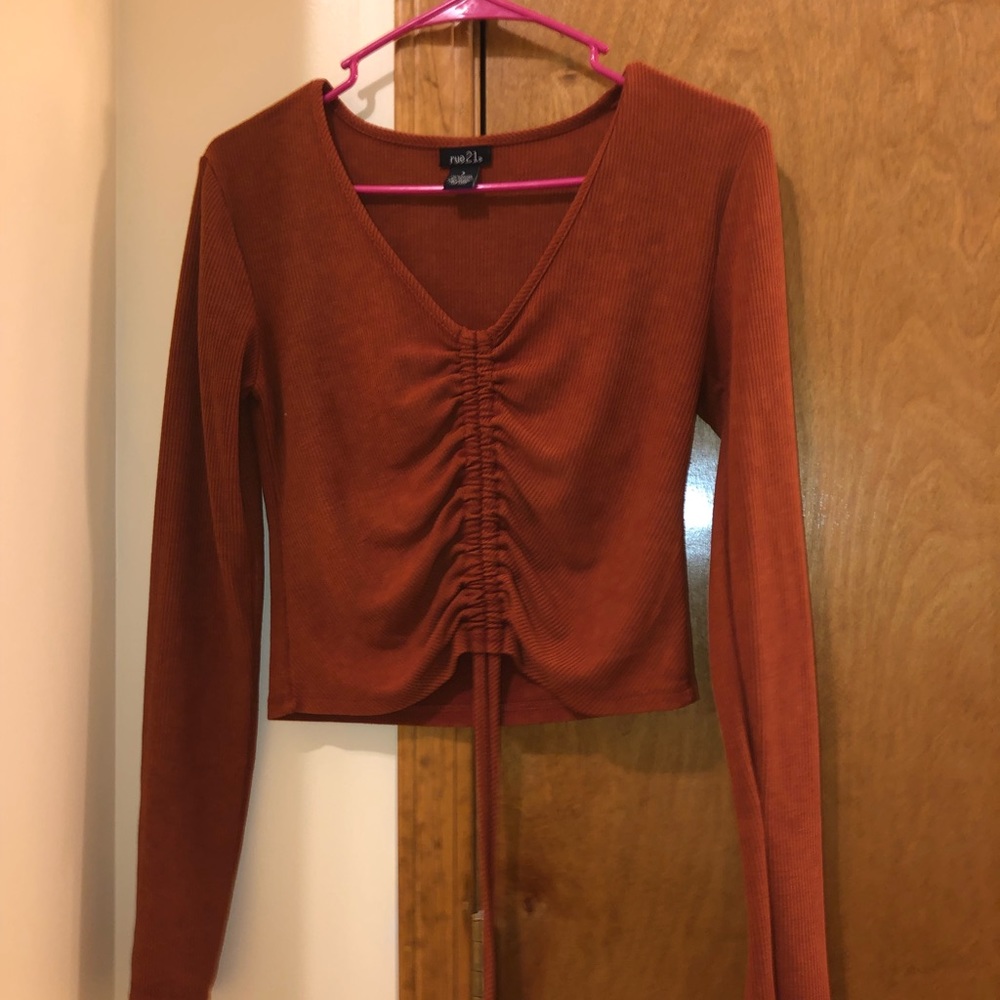 Rusty colored long sleeved shirt